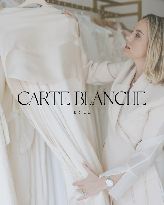 Anastasia at Carte Blanche Bride reviewing a modern wedding gown in the Melbourne showroom