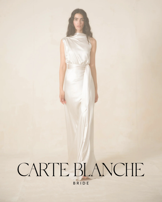 A close-up of the Bela Gown by Cortana, featuring a minimalist liquid silk satin silhouette for the modern bride.