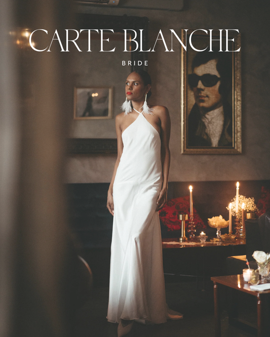 A modern bride wearing the elegant Kennedy Gown by Carte Blanche Bride, featuring a sleek silhouette perfect for a luxury 2026 elopement.