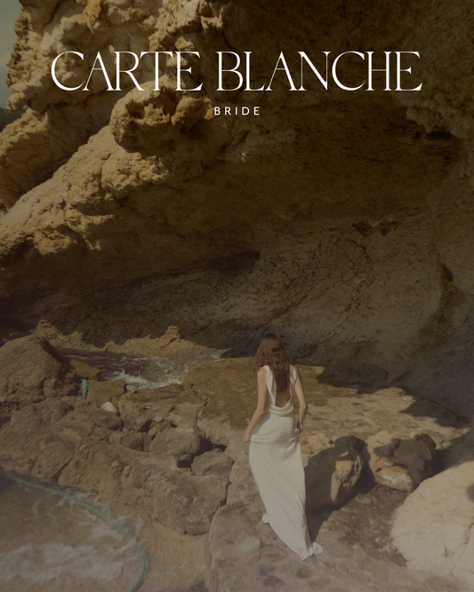 Relaxed bride wearing a flowing luxury European wedding dress from Carte Blanche Bride.