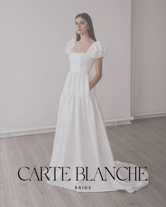The architectural Cora puff-sleeve wedding dress with pockets by Unbridled Studio, representing the modern British bridal aesthetic at Carte Blanche Bride.