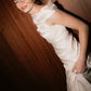 Model wearing the ruched silk Bella Set top from The Muse Collective 2027 collection at Carte Blanche Bride Australia, looking back over her shoulder.