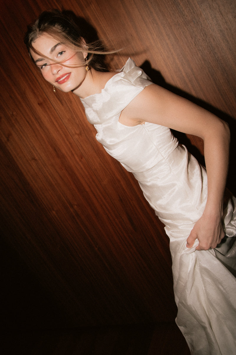 Model wearing the ruched silk Bella Set top from The Muse Collective 2027 collection at Carte Blanche Bride Australia, looking back over her shoulder.