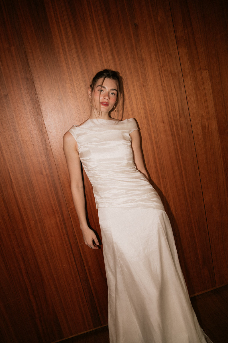 Front view of the asymmetric ruched top and column skirt from the Bella Set by The Muse Collective.