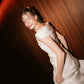 Side angle of the off-shoulder Bella Set silk bridal top and skirt by The Muse Collective, available at Carte Blanche Bride.