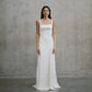 Full-length front view of the Unbridled Studio Clara silk gown with a square neckline and sleek column skirt at Carte Blanche Bride Australia.