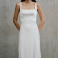 Medium front shot highlighting the fitted square-neck bodice and wide shoulder straps on the Clara gown.
