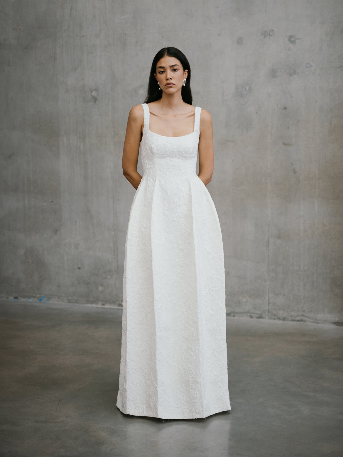 Front view of the modern textured A-line Thora wedding dress by Unbridled Studio, available through Carte Blanche Bride Melbourne.