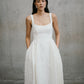 Medium front shot highlighting the square neckline and textured jacquard weave of the Thora wedding dress by Unbridled Studio.